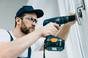 bearded-handyman-uses-power-drill-on-door-hardware-2026-01-06-00-44-55-utc2.webp